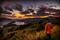 Anonymous person admiring view during sunset