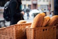 Anonymous person buying homemade bread at food market