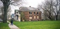 Anonymous Person Walks Sidewalk Derelict Abandoned Houses Detroit