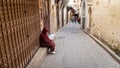 Anonymous poor beggar in the street of Fez, Morocco.