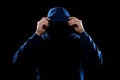 Anonymous silhouette of man in hoodie