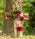 Anonymous urn grave with cross, forest cemetery