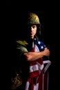 Symbolic image of Vietnam War veteran soldier holding the American flag. Royalty Free Stock Photo