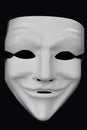 Anonymous white mask isolated on a black background Royalty Free Stock Photo