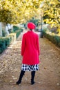 Anonymous woman in red coat on street Royalty Free Stock Photo