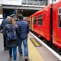 Anonymous Women And Men Passengers Leaving Or Disembarking A South Western Railway Train Royalty Free Stock Photo