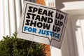 An anonymous yard sign that says: `Stand up, speak up, show up for justice` Royalty Free Stock Photo