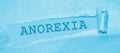 Anorexia word appearing behind brown torn paper. Eating disorders women healthcare concept