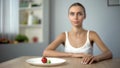 Anorexic girl consciously choosing severe diet, mental disease, starving body Royalty Free Stock Photo