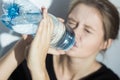 Anorexic girl drinking water Royalty Free Stock Photo