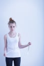 Anorexic girl measuring her waist Royalty Free Stock Photo