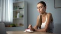 Anorexic girl trying to eat cake, inability to digest food, health problems Royalty Free Stock Photo