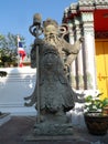 Wat Pho Thai Massage School Service Center. Another attraction of Wat Pho. Chinese stone statues adorned by arches and places.