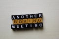 Another Boring Meeting on wooden blocks. Business and inspiration concept Royalty Free Stock Photo