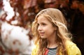 Another carefree day playing outside. a cute little girl playing outside on an Autumn day. Royalty Free Stock Photo