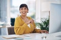 Another day, another dollar. Cropped portrait of an attractive young businesswoman sitting alone in her office during Royalty Free Stock Photo