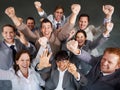 Another deal sealed. Top view of a group of young business executives celebrating together. Royalty Free Stock Photo