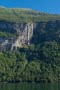 Another impressive waterfall, called Gjerdefossen, dropping from the high cliffs in the Geiranger Fjord Royalty Free Stock Photo