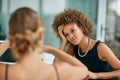 Another long day at the office. two coworkers talking together while sitting in a modern office. Royalty Free Stock Photo