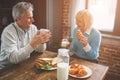 Another picture of nature old people sitting in the kitchen. THe Royalty Free Stock Photo