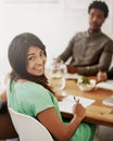 Another positive meeting in the books. Portrait of a two smiling young coworkers sitting at a boardroom table.