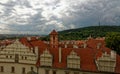 Another shot of monumental tower on the red roof building with chimneys