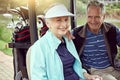 Another successful golfing day. Portrait of a smiling senior couple riding in a cart on a golf course. Royalty Free Stock Photo