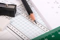Answer sheet focus on pencil and fingers. Royalty Free Stock Photo