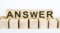 ANSWER word from wooden blocks on desk, search engine optimization concept