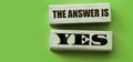 The answer is YES words on wooden blocks. Business,or education concept Royalty Free Stock Photo