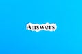 answers text on paper. Word answers on torn paper. Concept Image