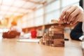 Ant eye view Male hand stacking wooden blocks. Business development and growth concept Royalty Free Stock Photo