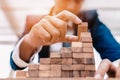 Ant eye view Male hand stacking wooden blocks. Business development and growth concept Royalty Free Stock Photo