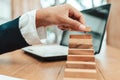 Ant eye view Male hand stacking wooden blocks. Business development and growth concept Royalty Free Stock Photo