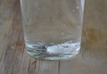 Antacids in water glass on wooden table Royalty Free Stock Photo