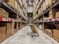 Antalya, Turkey - April 1, 2023: A cart in warehouse aisle in an IKEA store