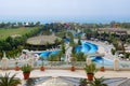 The swimming pool and beach with water slides at Royal Holiday Palace luxury hotel and tourists are on vacation