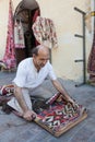 Turkish carpet master repearing old traditional turkish carpet