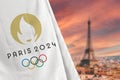 Antalya, Turkey - August 18, 2023: Paris 2024 Olympic Games flag in front of blurred Paris skyline
