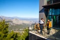 Antalya, Turkey - December 19, 2019: Observation deck with view on mountain landscape and tourist on it in sunny day. Fantastic