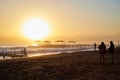 Antalya, Turkey - December 15, 2019: View from beach to water of sea, waves with white foam and black silhouette of person in a