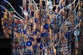 Antalya, Turkey - March 26, 2022: Artificial tree with Nazar Boncugu, blue eye-shaped amulets believed to protect against the evil