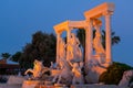 Antalya, Turkey - May, 2021: The symbol of the Alva Donna Exclusive Hotel - statues near the pool in the evening colorful lighting