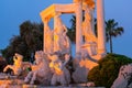 Antalya, Turkey - May, 2021: The symbol of the Alva Donna Exclusive Hotel - statues near the pool in the evening colorful lighting