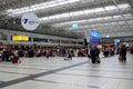 Interior of Antalya International Airport Terminal Two with passengers waiting for registration to flights