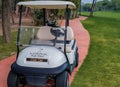 Antalya, Turkey, November 2019: a Golf Car with a bag of golf clubs on the track among the golf courses Royalty Free Stock Photo