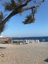 Beach view of the Mediterranean Sea in Turkey. City Beach of Antalya. Tourists are resting on the seashore