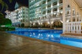 ANTALYA, TURKEY - SEPTEMBER 12, 2019: Exterior and swim pool at night of Titanic Mardan Palace elite all-inclusive hotel