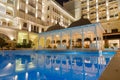 ANTALYA, TURKEY - SEPTEMBER 12, 2019: Exterior and swim pool at night of Titanic Mardan Palace elite all-inclusive hotel