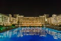 ANTALYA, TURKEY - SEPTEMBER 12, 2019: Exterior and swim pool at night of Titanic Mardan Palace elite all-inclusive hotel